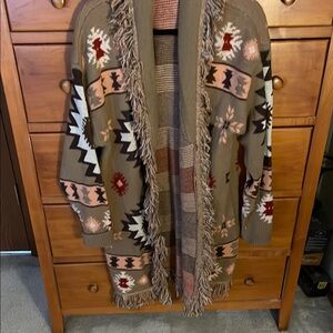 Beautiful new without tags JODIFL open cardigan with fringe. Size medium.